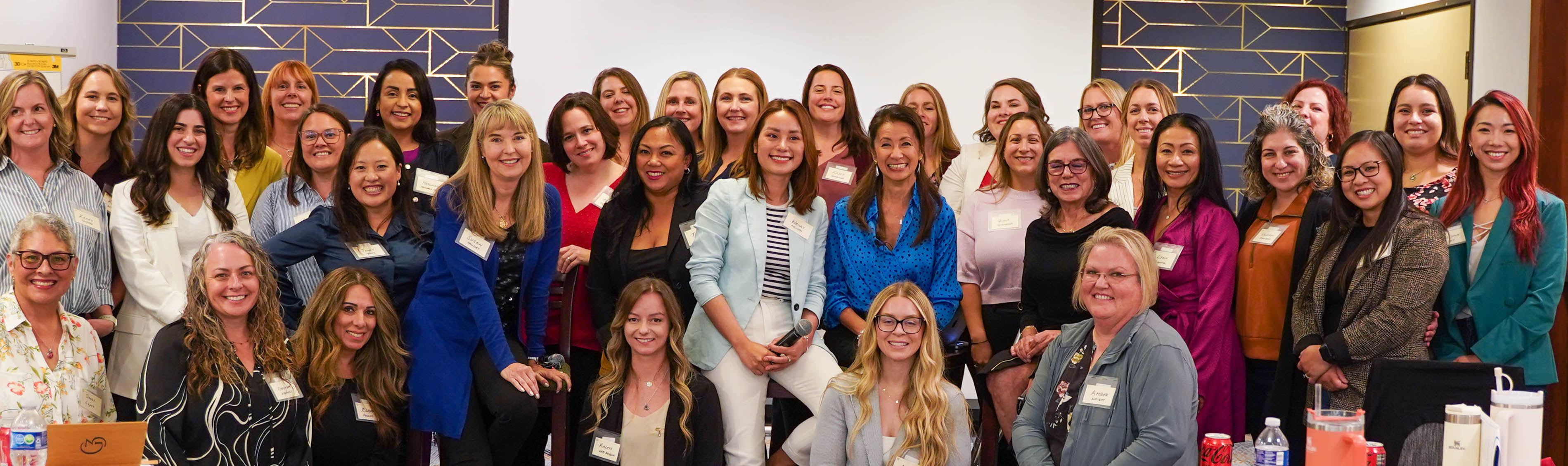 A group shot of attendees with Bernadette